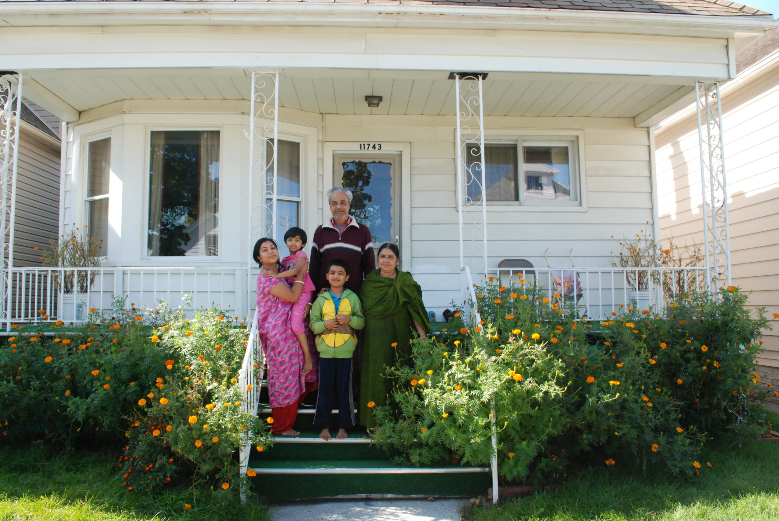 A resident in front of his home in Detroit, MI.